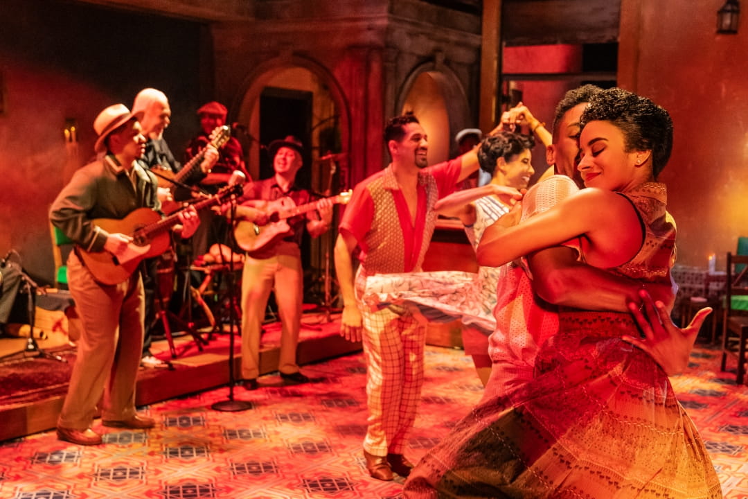 Cast members dancing in the foreground while the band plays in The Broadway Company of Buena Vista Social Club. Photo By Matthew Murphy