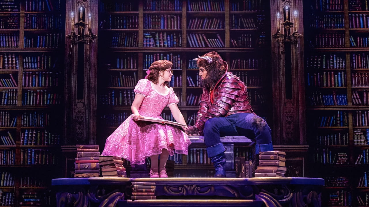 Kyra Belle Johnson and Fergie L. Philippe in Disney's Beauty and the Beast. Photo By Matthew Murphy. (C) Disney. Belle and the Beast in a library.