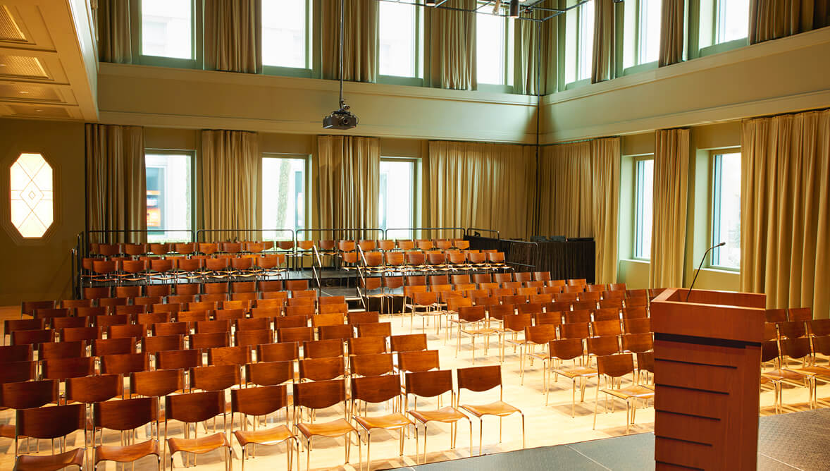 A photo of Troesh Studio Theater during the daytime with chairs and a mic.