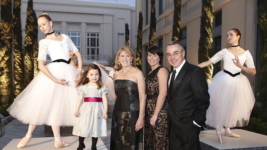 Don Snyder with his wife Dee, their daughter Christy and their granddaughter Zaine, flanked by two ballerinas, at The Smith Center’s opening-night celebration in 2012.