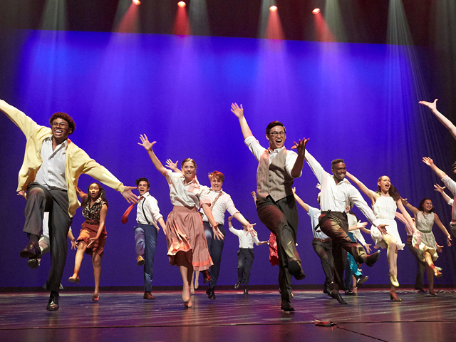 A nominated high school cast performing on the Reynolds Hall stage at The Smith Center. 