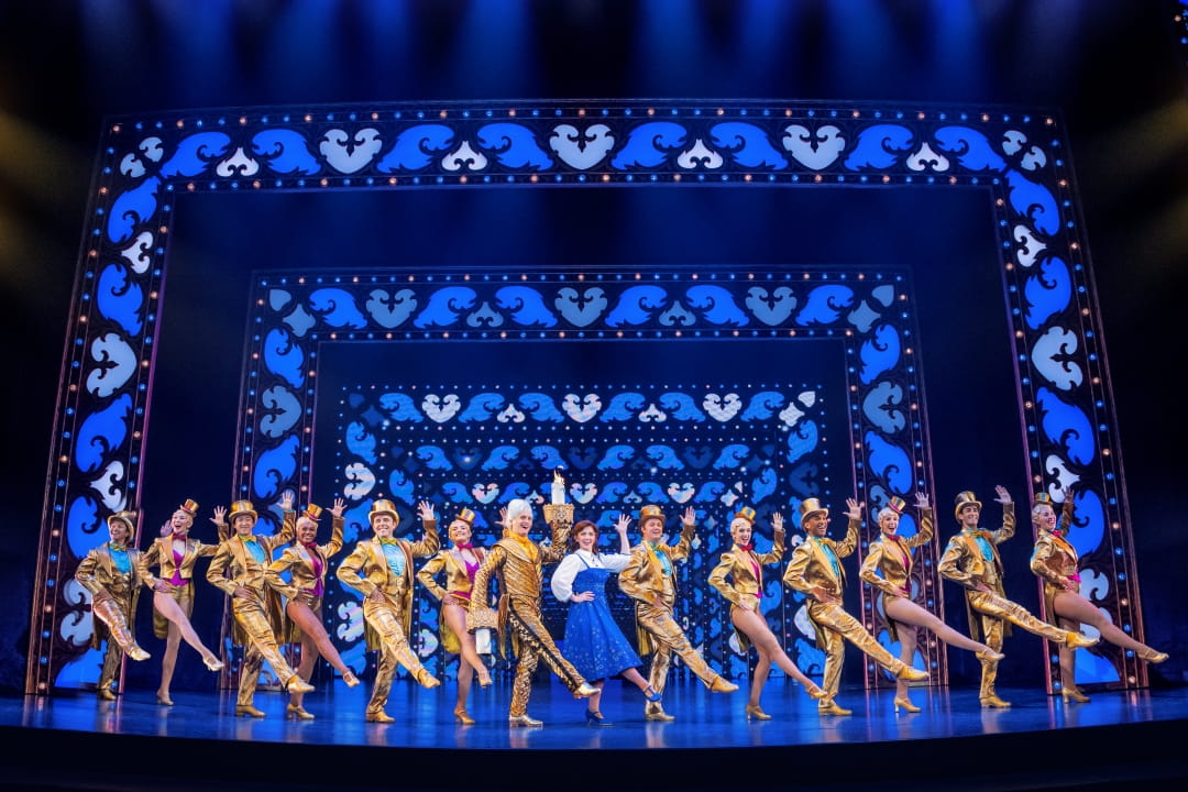 Danny Gardner and Kyra Belle Johnson leading an elaborate dance number with the Company of Disney's Beauty And The Beast. Photo By Matthew Murphy.