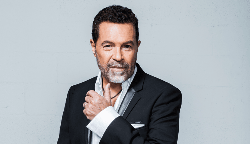 An image of singer Clint Holmes wearing a black suit