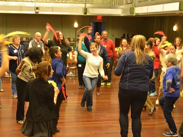 Teachers dancing during a professional development class lead by The Smith Center teaching artists.