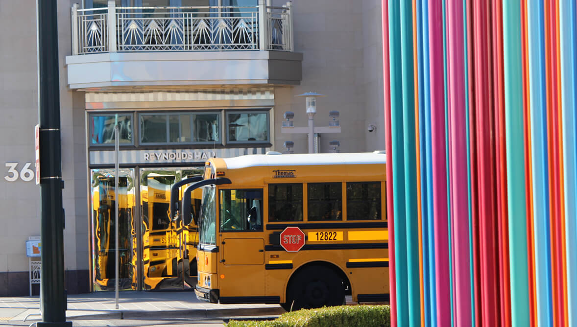 A bus behind the Pipe Dream sculpture fronting The Smith Center entrance, by Tim Bavington 